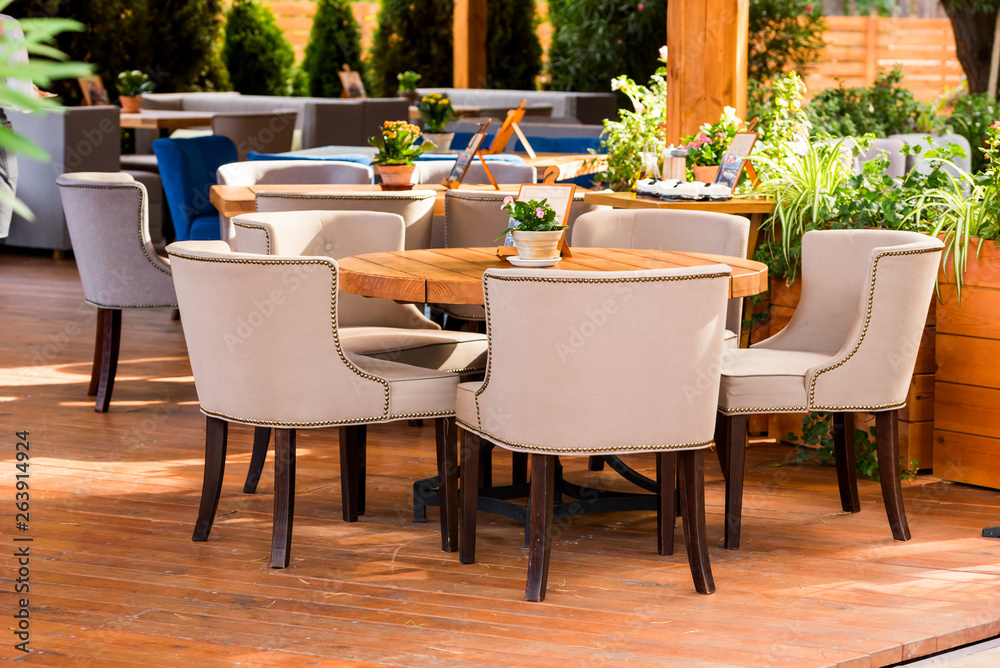 Obraz premium modern outdoor furniture in a cafe on the summer area, tables and chairs