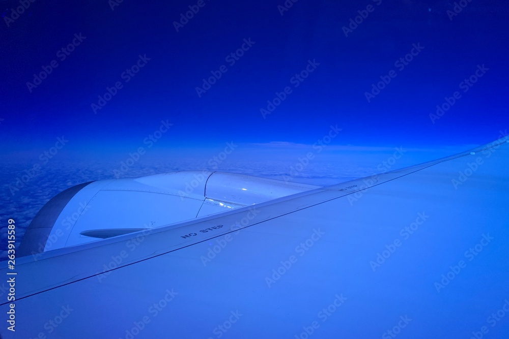 Fototapeta premium airplane flying over clouds