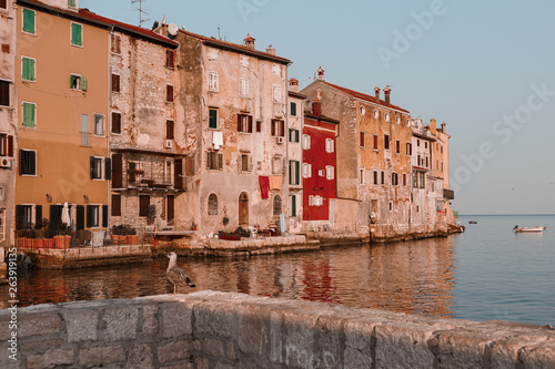 Rovinj, Croatia. Medieval vintage houses of old town. high tower of Church of Saint Euphemia. Morning sunrise blue sky