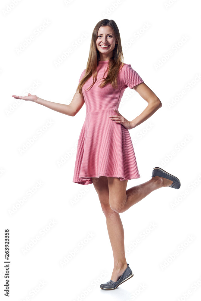 Woman in pink dress holding blank copy space on the palm Woman in pink dress holding blank copy space on the palm