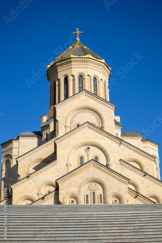 Tsminda Sameba or The Holy Trinity Cathedral of Tbilisi, Georgia in clear weather, bottom view from stairs