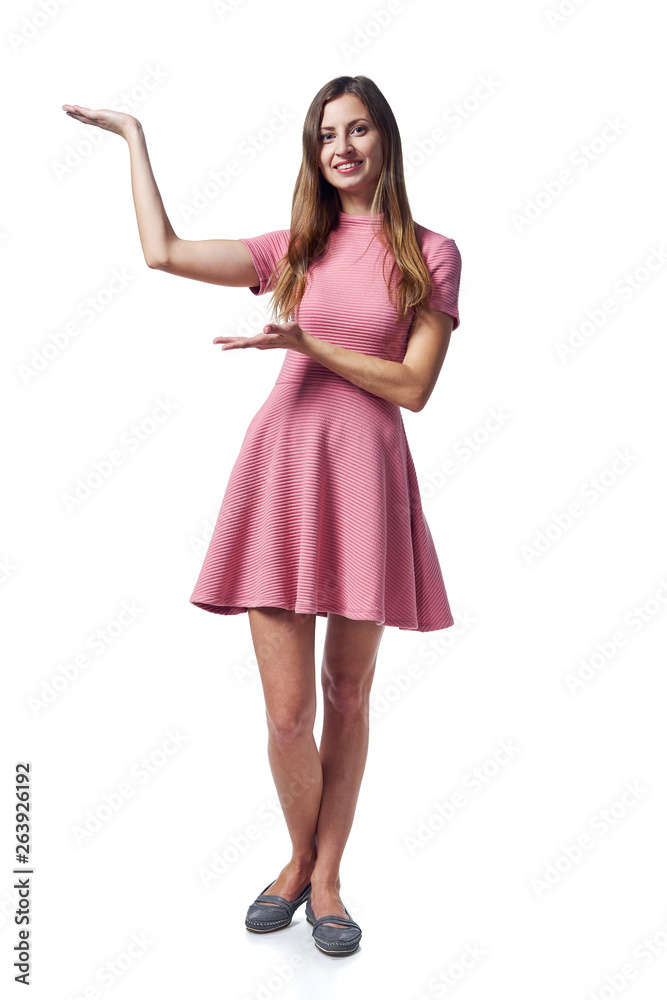 Woman in pink dress showing blank copy space
