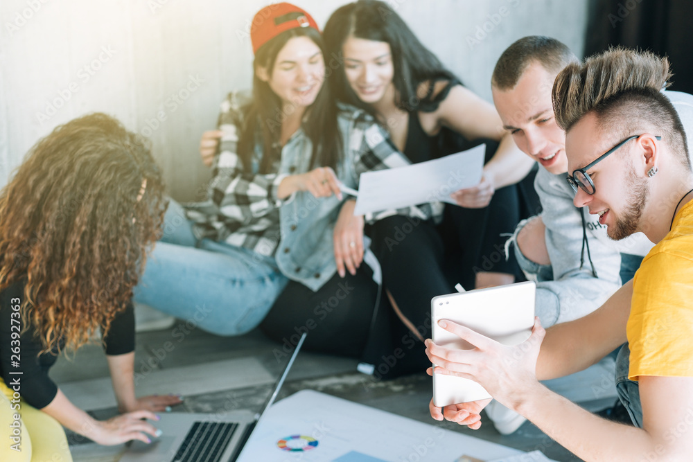 Millennial coworkers. Young creative team working together in casual atmosphere. Modern business operations. Millennial coworkers. Young creative team working together in casual atmosphere. Modern business operations.