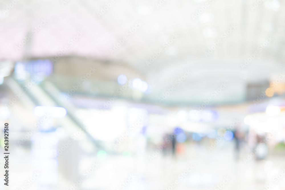 Abstract blur airport terminal. Blurred hall interior in transportation building. Defocused effect background or backdrop for travel industry concept.