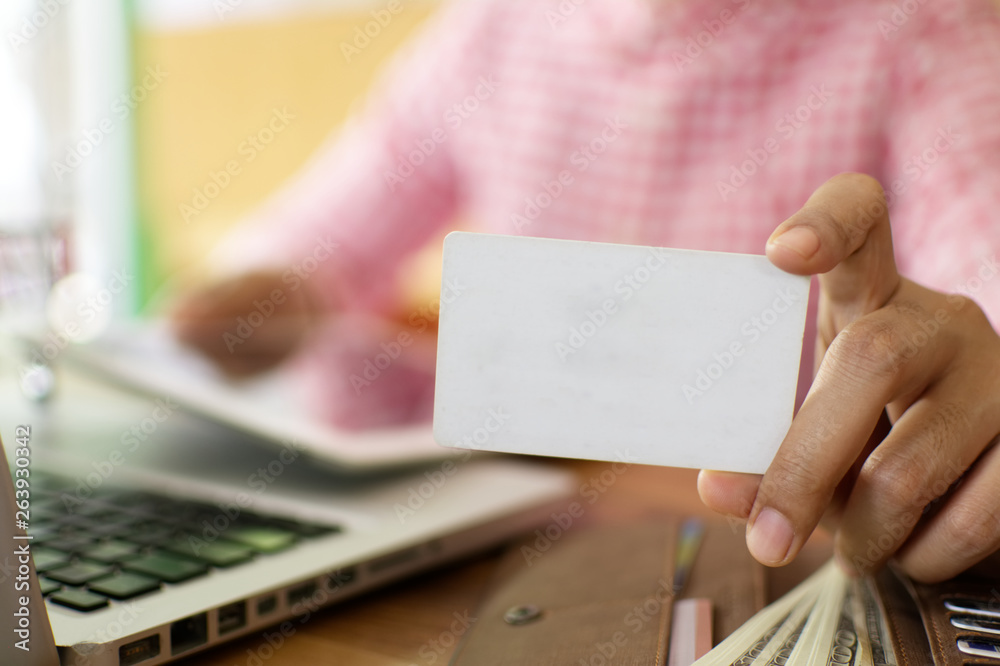 Young woman holding credit card payment for business shopping online. Young woman holding credit card payment for business shopping online.