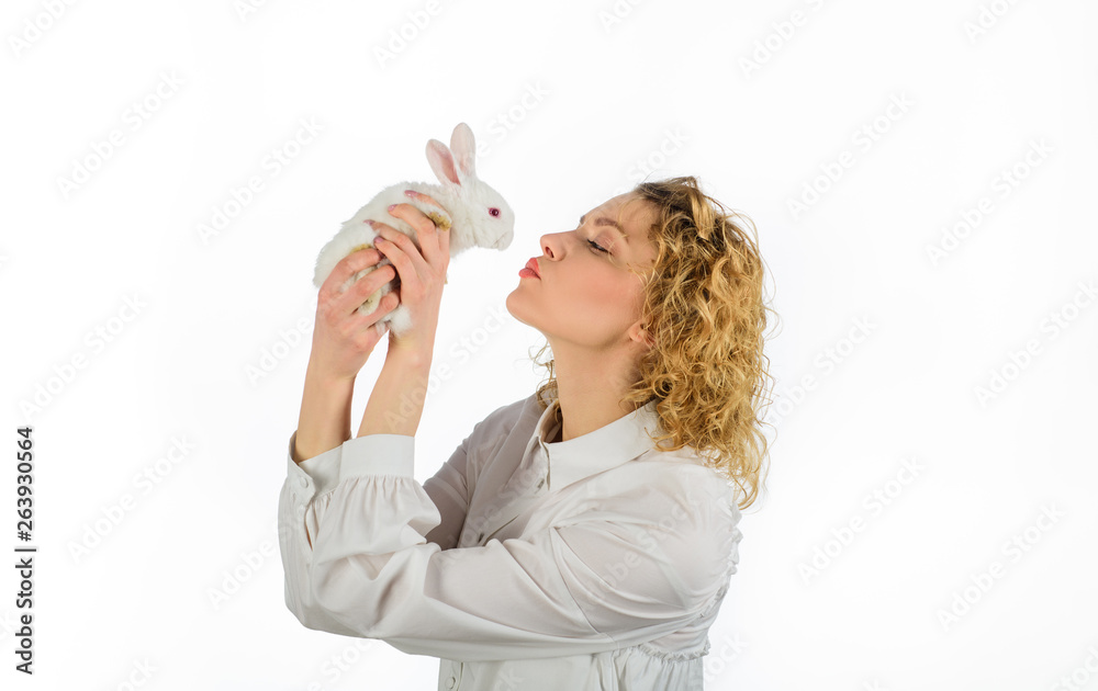 Beautiful girl kisses white baby rabbit. Easter rabbit. Easter Bunny. Happy woman with white rabbit. Girl holds cute little bunny. Friendship with Easter Bunny. Cute furry rabbit. Easter day concept. Beautiful girl kisses white baby rabbit. Easter rabbit. Easter Bunny. Happy woman with white rabbit. Girl holds cute little bunny. Friendship with Easter Bunny. Cute furry rabbit. Easter day concept.