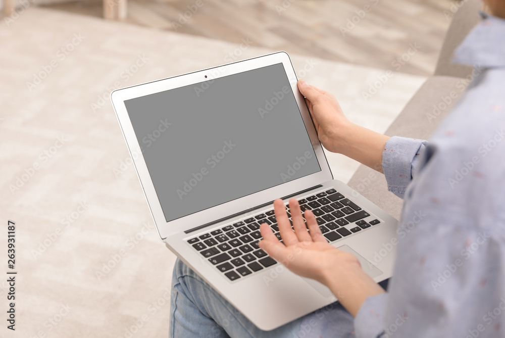 Young woman using video chat on laptop at home, closeup. Space for design Young woman using video chat on laptop at home, closeup. Space for design