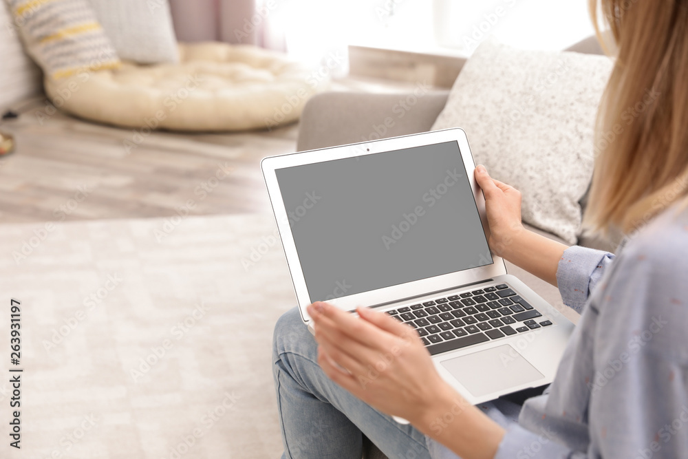 Young woman using video chat on laptop in living room, closeup. Space for design Young woman using video chat on laptop in living room, closeup. Space for design
