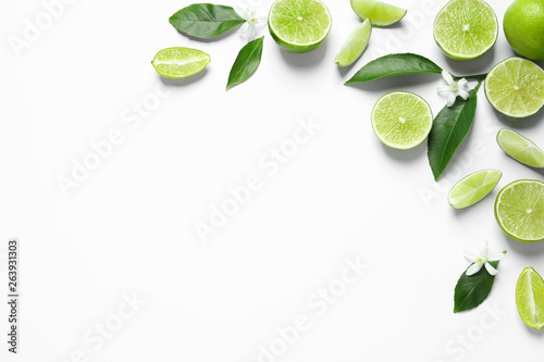 Wallpaper Mural Frame made of limes, flowers and leaves on white background, top view with space for text. Citrus fruits Torontodigital.ca