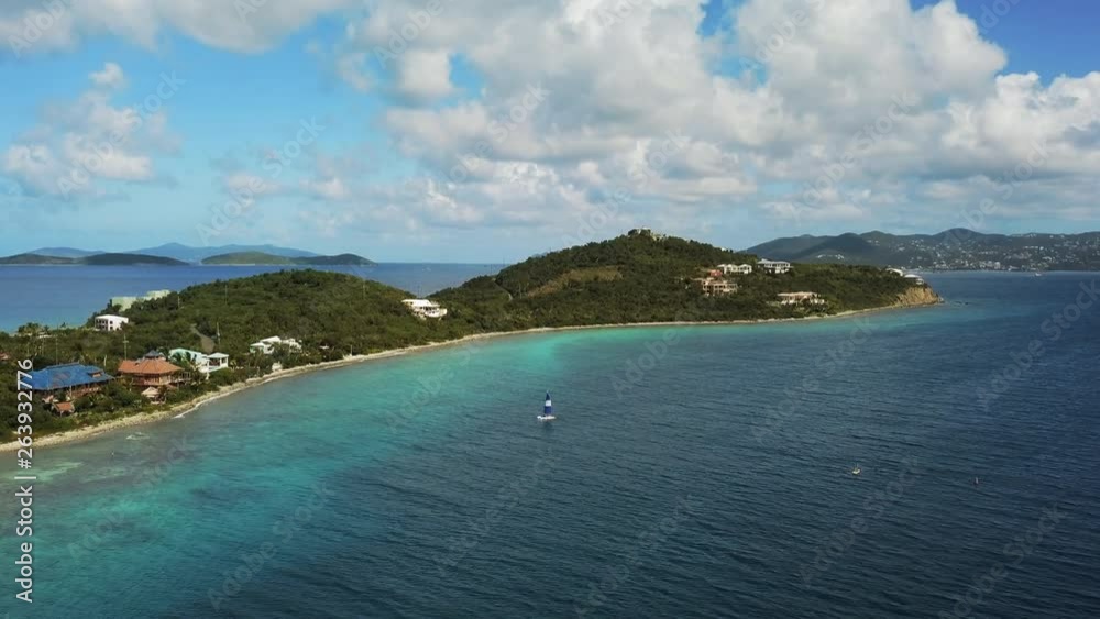 Aerial: Descending on Blue Catamaran Sailing in the US Virgin Islands in St. Croix, US Virgin Islands Aerial: Descending on Blue Catamaran Sailing in the US Virgin Islands in St. Croix, US Virgin Islands