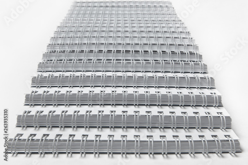 Stairs up from the white pads with the springs.