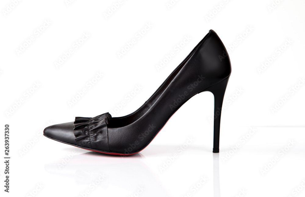 Black high heel women shoes with red sole and flounce isolated on white background Black high heel women shoes with red sole and flounce isolated on white background