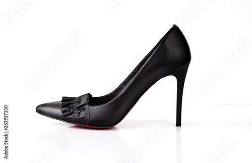 Black high heel women shoes with red sole and flounce isolated on white background