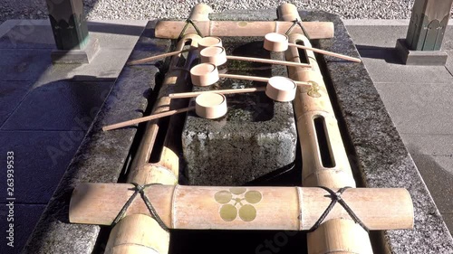 Water ablutions pavilion for a ceremonial purification at Oyama Shrine, Kanazawa, Japan photo