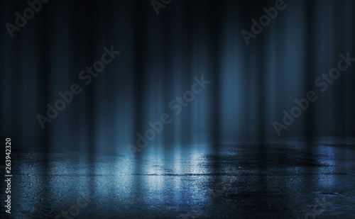 Empty background scene. Dark street reflection on the wet pavement. Rays of blue neon light in the dark, neon figures, smoke. Night view of the street, the city. Abstract dark background. © Laura Сrazy