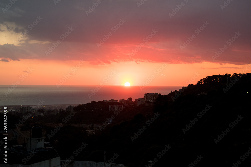 This is a capture of a sunset in Beirut and you can see the orange color formed by the sun and the beautiful horizon