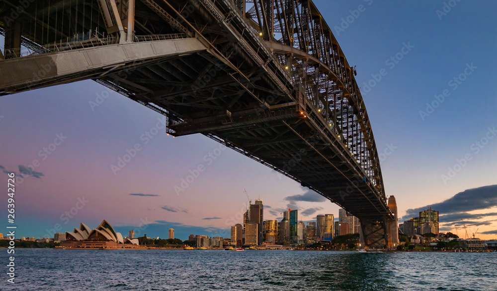 View towards Sydney from under the Harbour Bridge at sunset