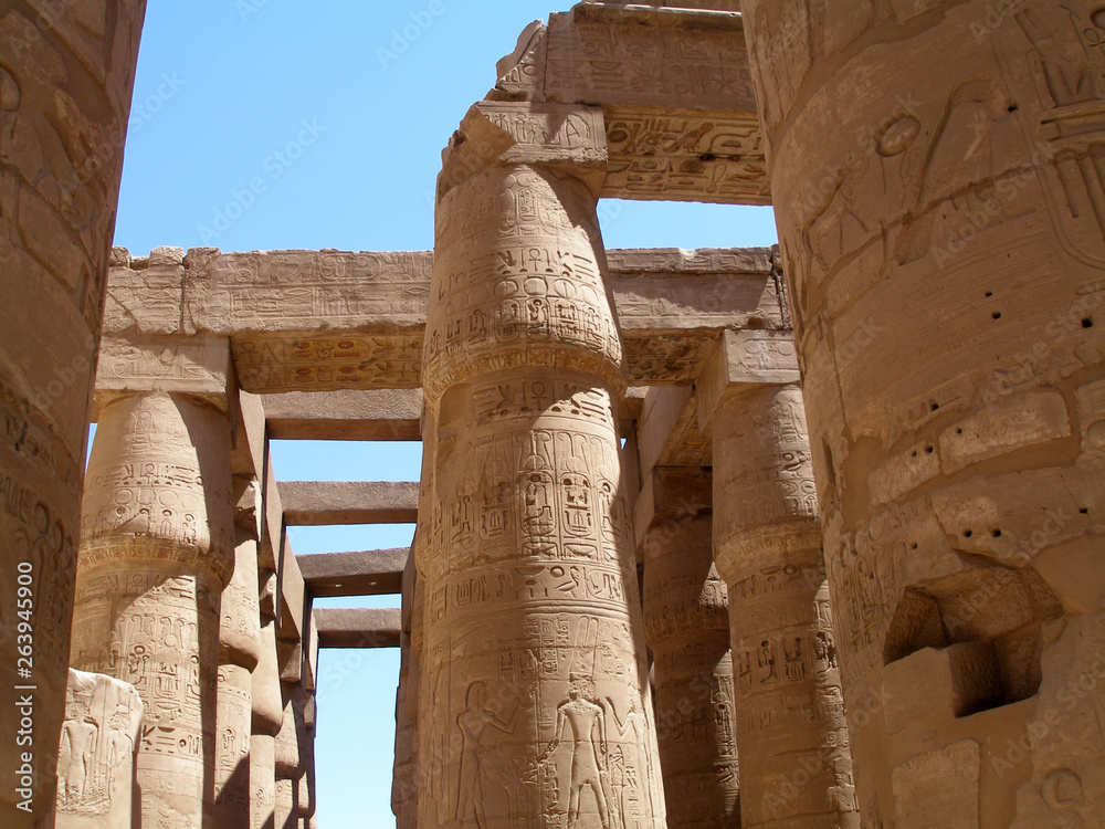 Hieroglyphs on pillars of the Great hypostyle hall at the Karnak temple of Amun-Ra, Luxor. Architecture and art of Ancient Egypt Hieroglyphs on pillars of the Great hypostyle hall at the Karnak temple of Amun-Ra, Luxor. Architecture and art of Ancient Egypt