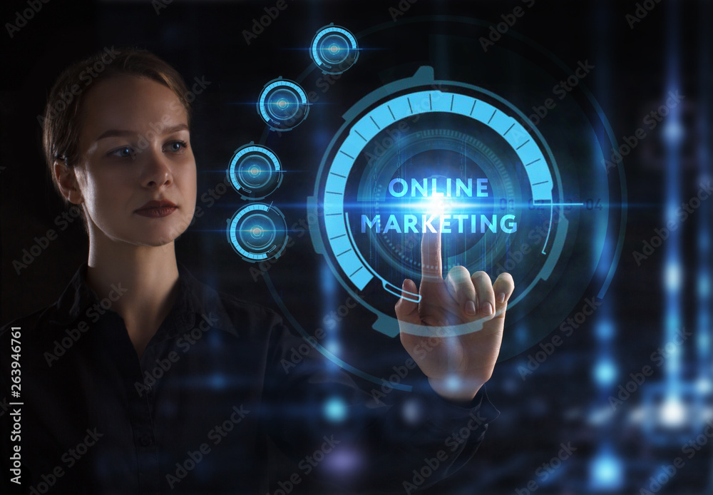 The concept of business, technology, the Internet and the network. A young entrepreneur working on a virtual screen of the future and sees the inscription: Online marketing The concept of business, technology, the Internet and the network. A young entrepreneur working on a virtual screen of the future and sees the inscription: Online marketing