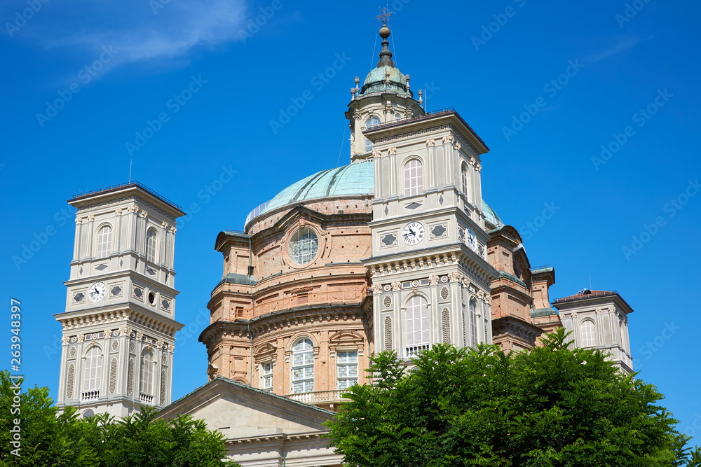 Sanctuary of Vicoforte church with bell tower and red bricks building in a sunny summer day in Piedmont, Italy