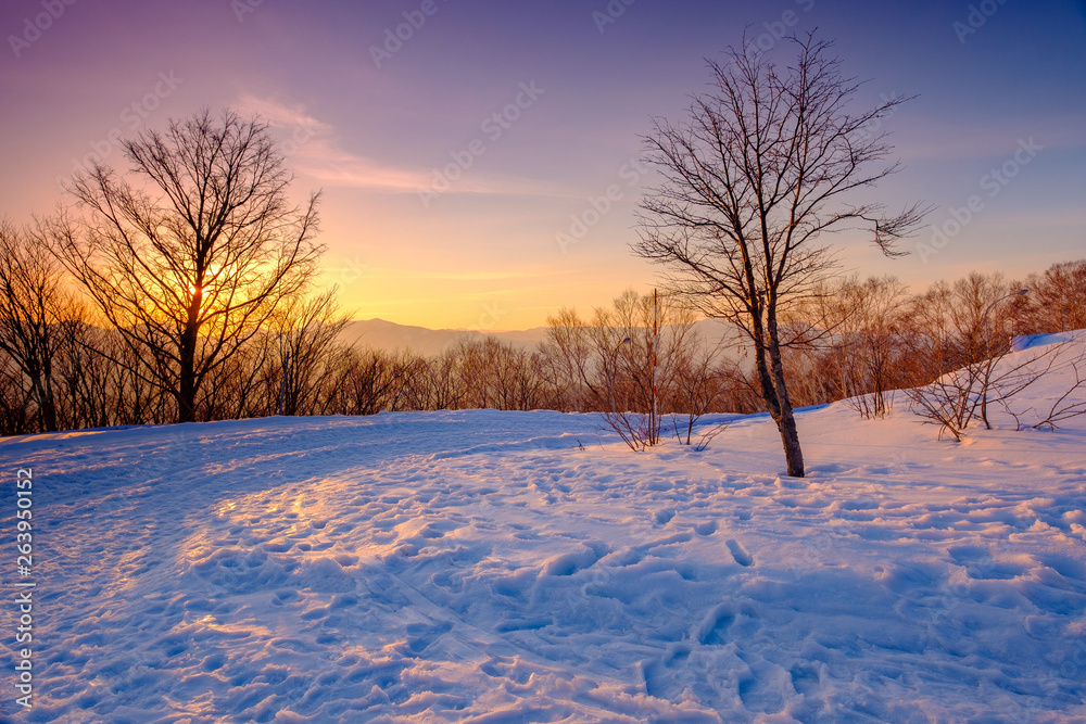 Sunset view on the top of Moiwa mountain in winter snow Sunset view on the top of Moiwa mountain in winter snow