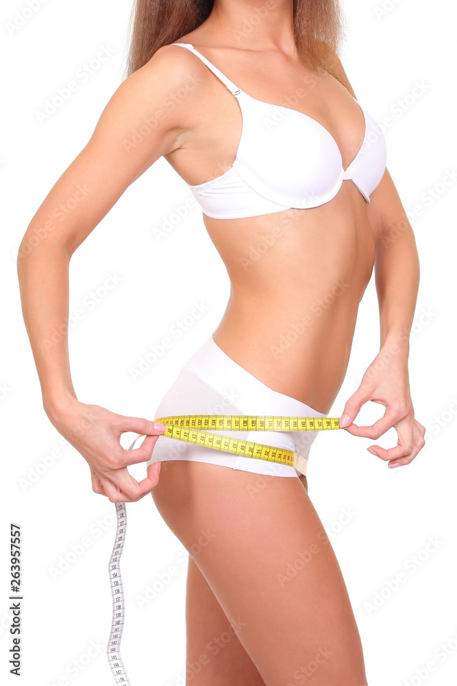 Woman measuring her slim body