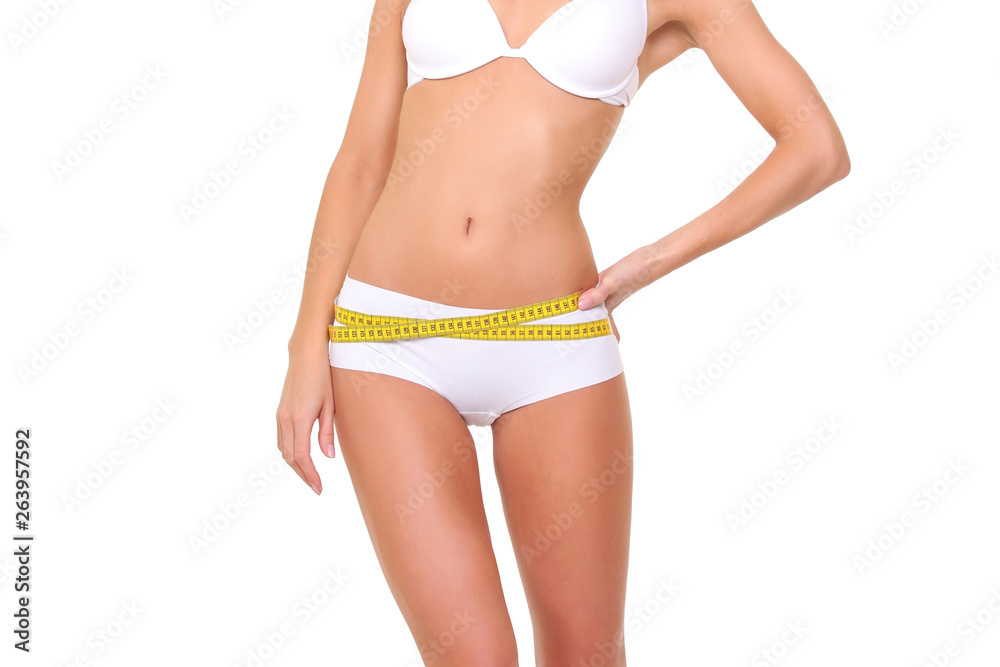 Woman measuring her slim body