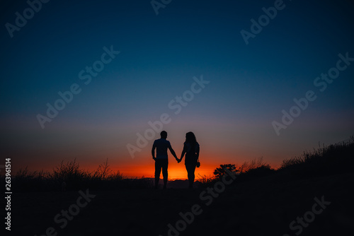 Young couple enjoying sunset in the mountains © Vasyl Dovhun