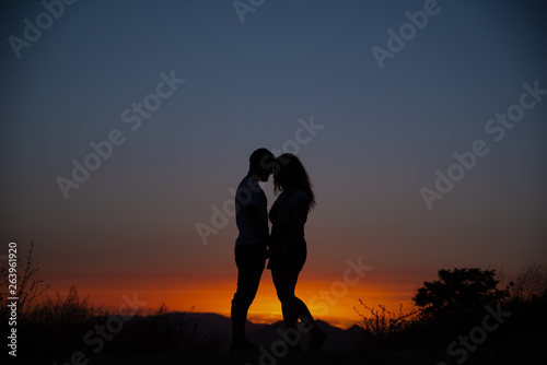 Young couple enjoying the sunset. © Vasyl Dovhun