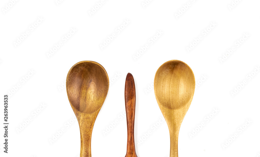 Empty wooden spoons isolated on white background, close up Empty wooden spoons isolated on white background, close up