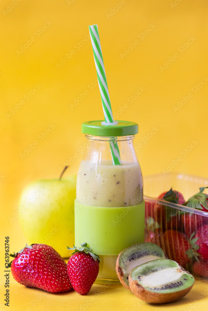 kiwi and apple smoothies on a yellow background kiwi and apple smoothies on a yellow background