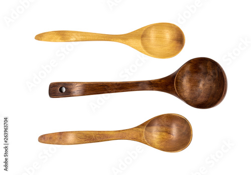 Empty wooden spoons isolated on white background, close up