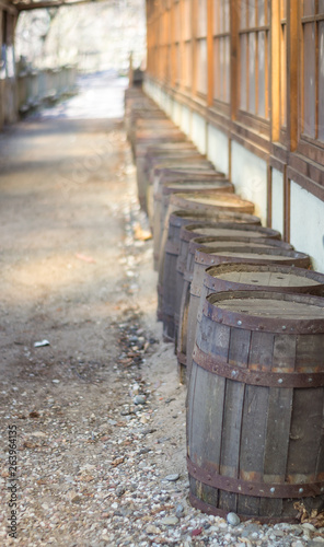 wooden barrels along the wall
