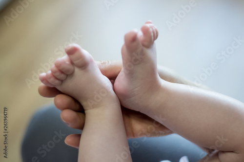 baby feet in hands