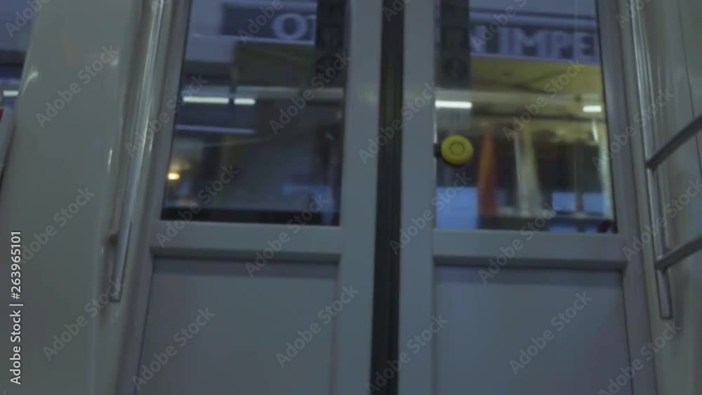 metro door showing the street passing outside metro door showing the street passing outside