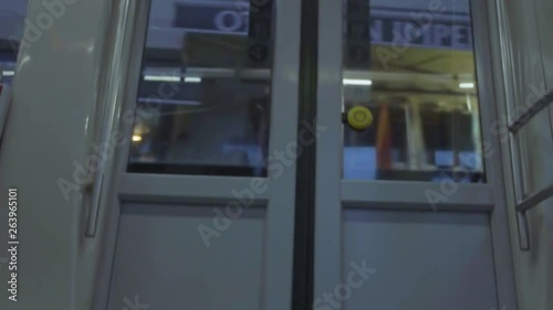 metro door showing the street passing outside