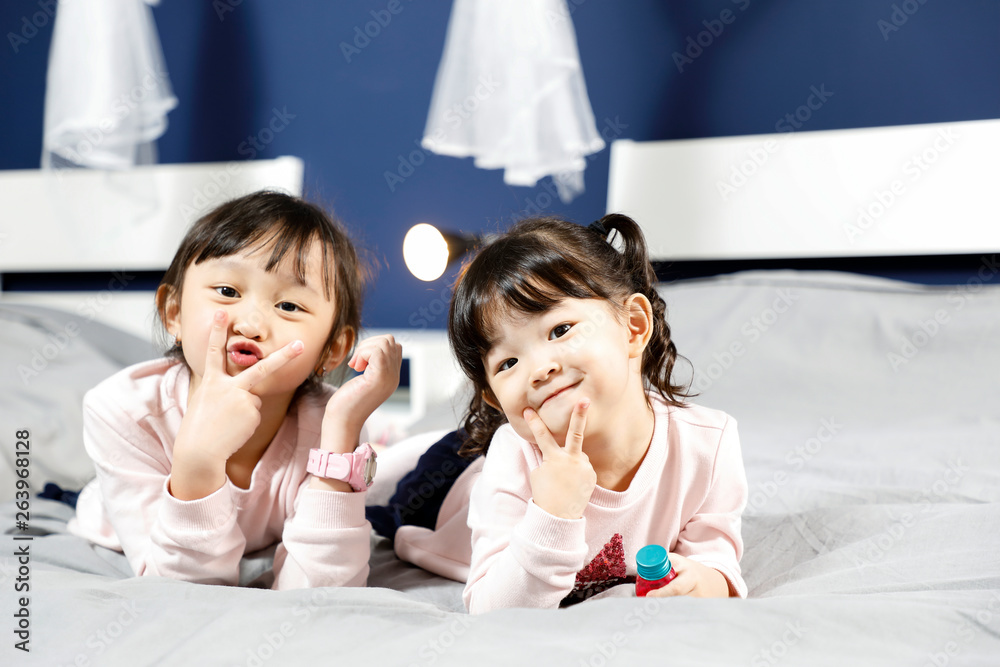 Two girl children looking forward posing Two girl children looking forward posing