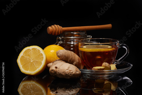 Honey and tea with spices and lemon.