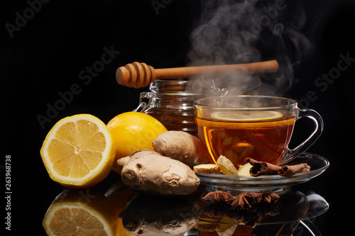 Honey and tea with spices and lemon.