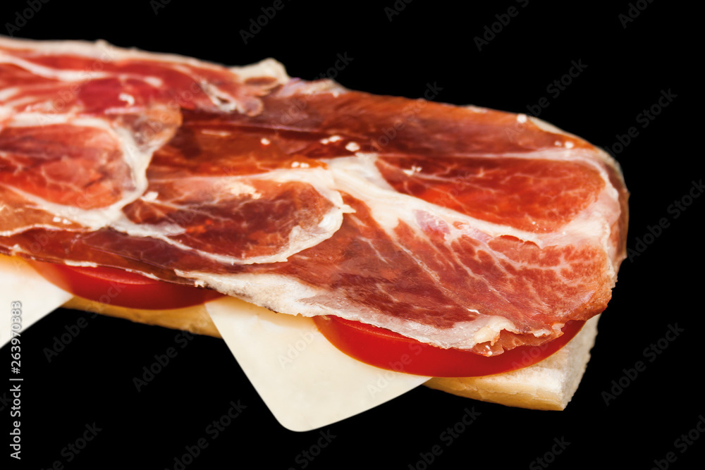 Closeup of a Spanish serrano ham toast. Selective focus. Closeup of a Spanish serrano ham toast. Selective focus.
