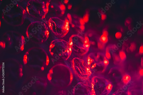 texture red cellophane with air bubbles, abstract, macro