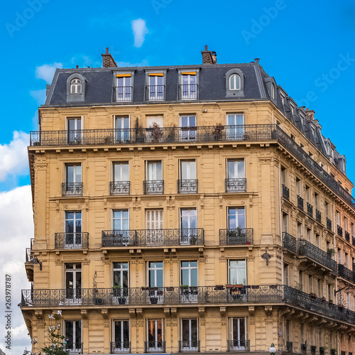 Paris, beautiful building in the center, typical parisian facade in the Marais 