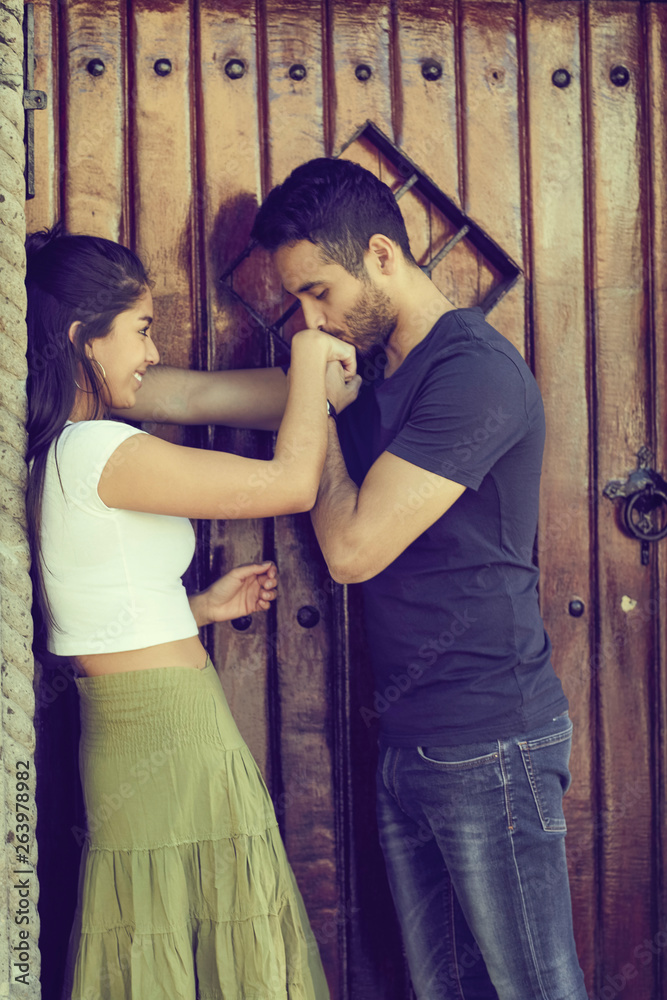 Couple in love outside a rustic house. Couple in love outside a rustic house.