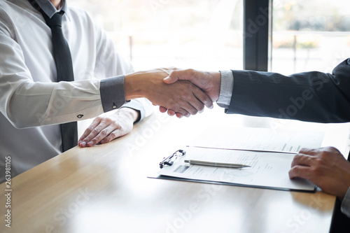 Successful job interview, Boss employer in suit and new employee shaking hands after negotiation and interview, career and placement concept