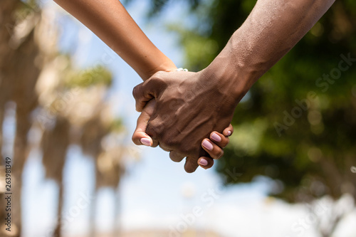 Close up outdoor protrait of black african american couple holding hands