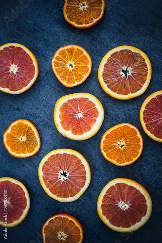 Sliced Blood Oranges and Tangerines on Dark Background