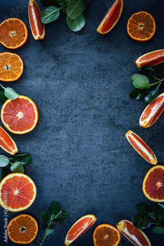 Sliced Oranges on Dark Textured Background
