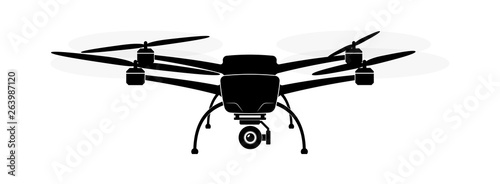 Quadcopter or copter flying in the air. Camera and shooting video or photo from the air.