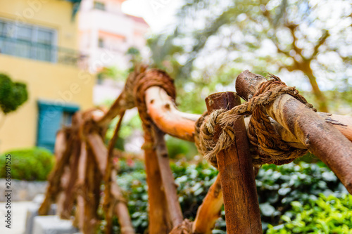 Vintage handrail made of the logs and hemp ropes