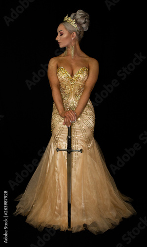 Golden goddess in crown with sword © Leo Stock Pix